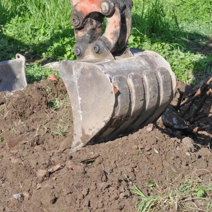 Finition de plateforme au godet de curage